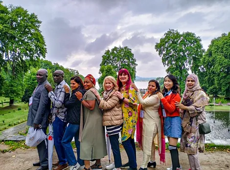 G20 delegates pose for a photo at Nishat Garden on the banks of Dal Lake, in Srinagar