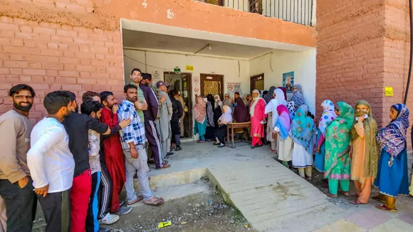 Voters wait in a queue at a polling station to cast their votes for the fifth phase of Lok Sabha elections, in Baramulla, Monday, May 20, 2024