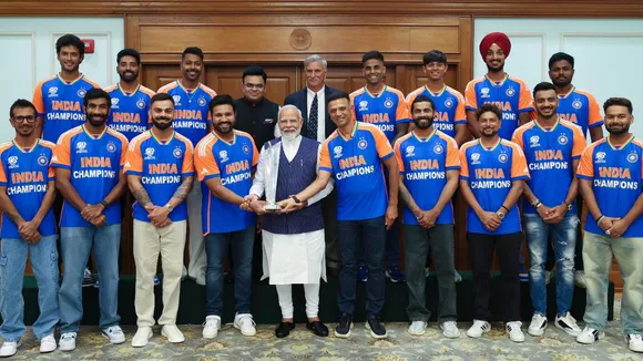 Prime Minister Narendra Modi poses for a group photograph with the 2024 T20 World Cup-winning Indian cricket team during an interaction, in New Delhi.