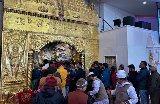Devotees at the sacred ancient cave of Shri Mata Vaishno Devi Shrine after it opened, in Katra, Sunday, Jan. 14, 2024. 