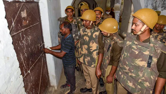 A room being sealed during a raid by UP Police at Allahabad University's Muslim hostel in connection with the Umesh Pal murder case, in Prayagraj, Monday