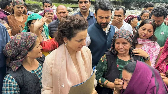 BJP MP Kangana Ranaut interacts with people during her visit to flood hit areas in Himachal Pradesh.
