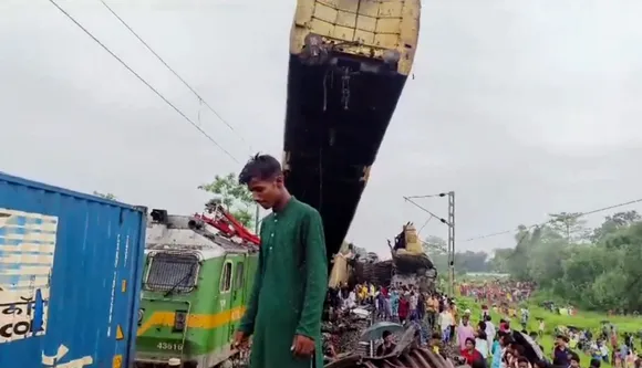 Locals gather after a collision between the Kanchanjungha Express and a goods train, near Rangapani railway station, on Monday, June 17, 2024.