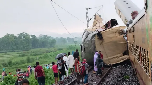 Locals gather after a collision between the Kanchanjungha Express and a goods train, near Rangapani railway station, on Monday, June 17, 2024.