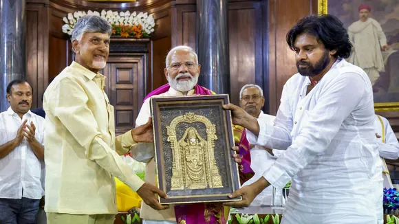 Prime Minister Narendra Modi being presented a memento by TDP chief N Chandrababu Naidu and Janasena Chief Pawan Kalyan during the NDA Parliamentary Party meeting at Samvidhan Sadan, in New Delhi, Friday, June 7, 2024.