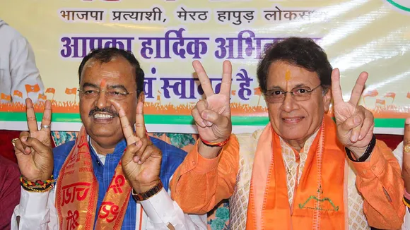 Uttar Pradesh Deputy Chief Minister and BJP candidate Keshav Prasad Maurya with party candidate Arun Govil during an election campaign rally ahead of upcoming Lok Sabha elections, in Meerut, Tuesday, April 2, 2024