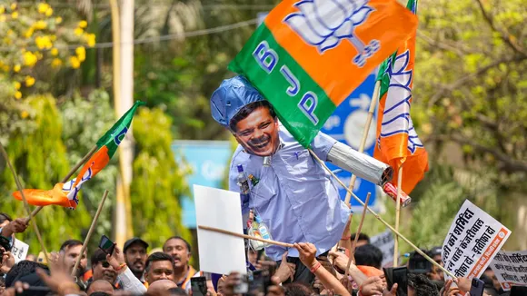 BJP workers stage a protest against AAP convener and Delhi CM Arvind Kejriwal, outside AAP office in New Delhi, Wednesday, April 10, 2024