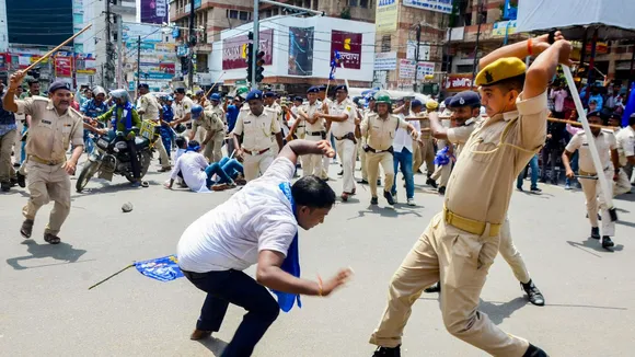 Police personnel lathi-charge protestors during the 'Bharat Bandh' called by SC/ST organisations over reservation issue, in Patna, Wednesday, Aug. 21, 2024.