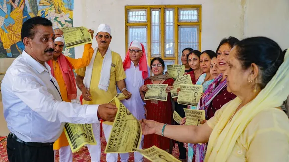 Independent candidate from Anantnag-Rajouri constituency Dilip Pandita during a door-to-door election campaign, in Anantnag, Sunday, May 19, 2024