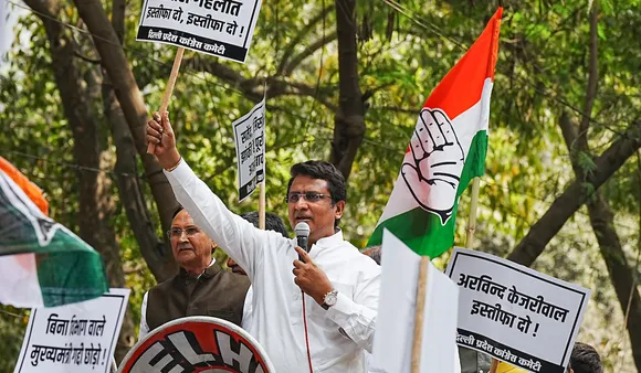 DPCC President Anil Chaudhary speaks during a protest demanding resignation of Delhi Chief Minister Arvind Kejriwal over the now-scrapped excise policy