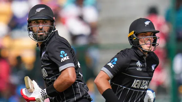 New Zealand’s Daryl Mitchell and Mark Chapman plays a shot during the ICC Men's Cricket World Cup 2023 match between New Zealand and Pakistan at M. Chinnaswamy Stadium, in Bengaluru, Saturday, Nov. 4, 2023