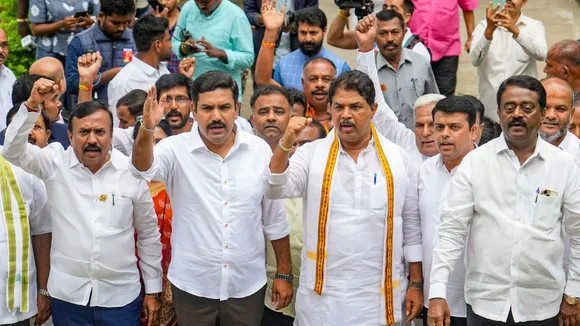 Leader of Opposition in Karnataka Assembly R Ashoka, BJP state President B Y Vijayendra with party MLAs and MLCs during a protest against the alleged misappropriation of Valmiki ST Corporation funds