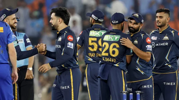 Gujarat Titans players celebrate their win against Mumbai Indians in the IPL 2023 cricket match at Narendra Modi Stadium on April 25