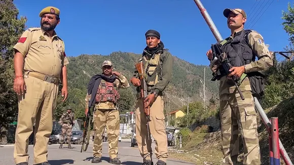 Security personnel stand guard along the Bani-Billawar road days after the Billawar terror attack, in Kathua, Monday, Sept. 30, 2024.
