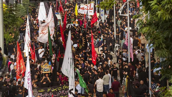 Shia Muslims participate in the 8th Muharram procession in Srinagar