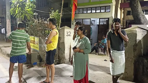 People come out of their homes after tremors were felt due to an earthquake, in Patna, Friday night, Nov 3, 2023.