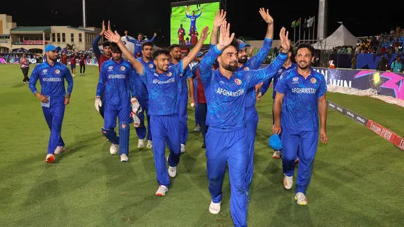 Afghanistan's captain Rashid Khan with teammates acknowledges fans after Afghanistan won the ICC Men's T20 World Cup cricket match against Bangladesh, at Arnos Vale Ground, Kingstown, Saint Vincent and the Grenadines, Monday, June 24, 2024