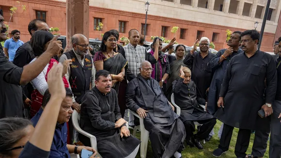 AP MP Sanjay Singh with Leader of Opposition in Rajya Sabha Mallikarjun Kharge and other opposition MPs during a protest over his suspension from Rajya Sabha