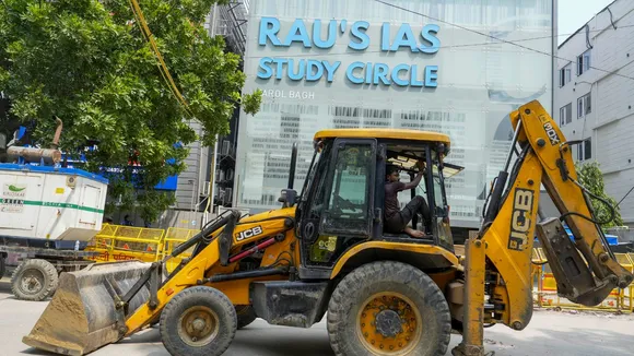 Excavators being used to demolish encroachments during a drive by MCD in Old Rajinder Nagar, in New Delhi, Monday, July 29, 2024.