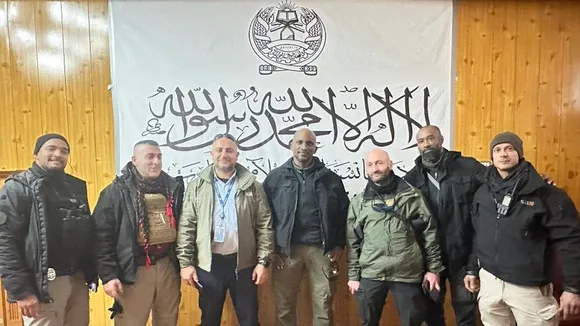 UN security personnel photo op with Taliban flag