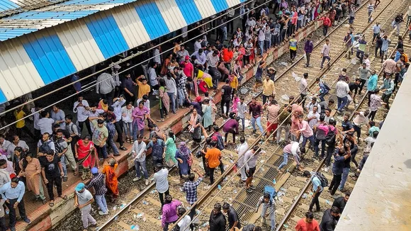 Angry people block railway tracks at Badlapur railway station in protest against the alleged sexual abuse of two girls at a school, in Thane district, Tuesday, Aug. 20, 2024.