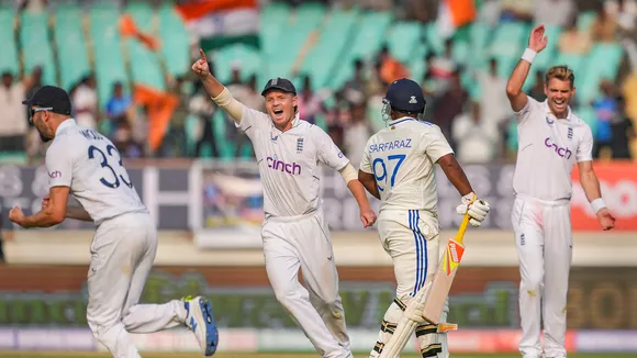 England's players celebrate the wicket of India's batter Sarfaraz Khan during the third Test cricket match between India and England, at Niranjan Shah Stadium, in Rajkot, Thursday, Feb. 15, 2024.