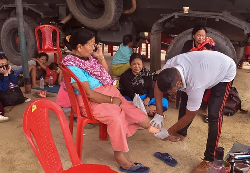 Army and Assam Rifles personnel assist people of violence-hit areas of Manipur, at a relief camp