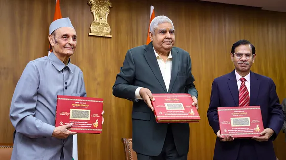 Vice President Jagdeep Dhankhar releases the book on Mundaka Upanisad authored by Karan Singh (L) at Upa-Rashtrapati Nivas