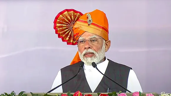 Prime Minister Narendra Modi addresses the gathering during the foundation stone laying ceremony of eight AMRUT projects, in Solapur