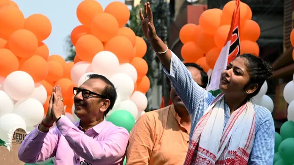 Trinamool Congress candidate from Jadavpur Constituency Saayoni Ghosh with West Bengal Sports Minister Aroop Biswas (L) during her election campaign for the upcoming Lok Sabha polls, in Kolkata