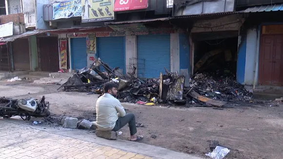 Charred remains of goods at a shop following clashes between two groups during a Ganesh Chaturthi procession, at Nagamangala in Mandya district, Thursday, Sept. 12, 2024.