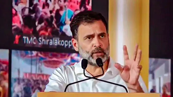 Congress leader Rahul Gandhi addresses a gathering during the inauguration of the state government's Gruha Laxmi scheme, in Mysuru