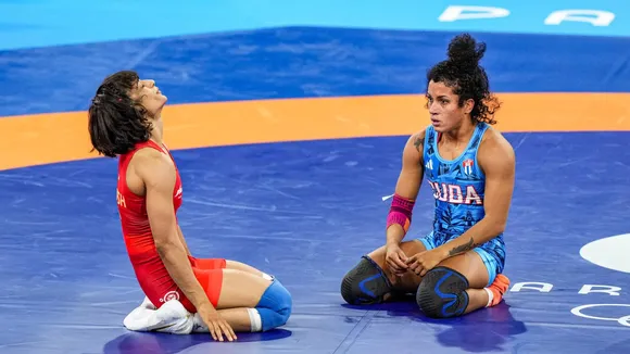 India's Vinesh Phogat (L) after winning her Women's Freestyle 50kg semi-final wrestling match against Cuba's Yusneylys Guzman Lopez at the 2024 Summer Olympics, in Paris, France, Tuesday, Aug. 6, 2024.