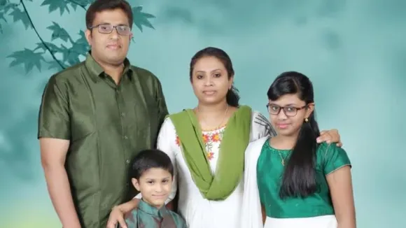 Mathew Mulackal, his wife Lini Abraham and their two children