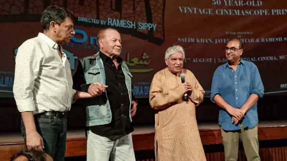 Screenwriter duo Salim Khan and Javed Akhtar with others during a special screening of film 'Sholay', at the Regal Cinema, in Mumbai, Saturday, Aug. 31, 2024. 