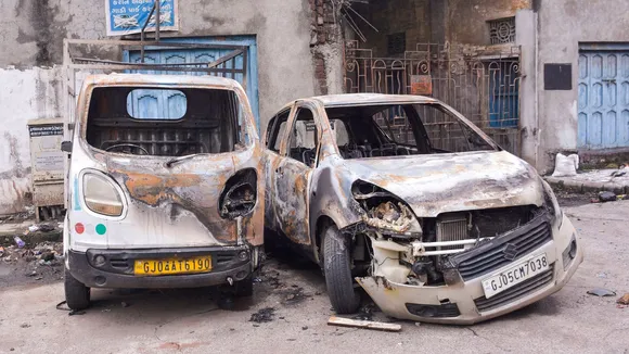 Charred remains of vehicles following a clash between two groups as an idol of Lord Ganesh was damaged after some persons allegedly threw stones at a pandal during the ongoing Ganpati festival on late Sunday night, in Surat, Monday, Sept 9, 2024.