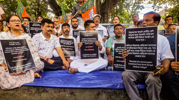 BJP leader Shankar Ghosh (centre) with other party leaders holds a placard during a protest against the West Bengal TMC govt., in Siliguri, Friday, Aug. 16, 2024