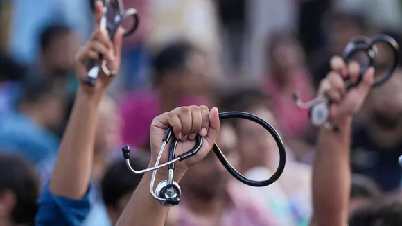 Junior doctors shot slogans as they march towards Swasthya Bhawan during a protest over RG Kar Hospital rape and murder incident, in Kolkata
