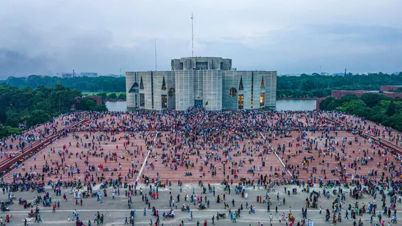 A photo taken with a drone shows people gather around at the Bangladesh Parliament House in Dhaka, Bangladesh, 05 August 2024.