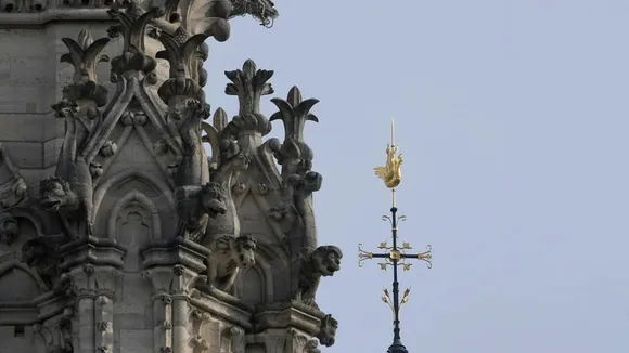 The cross and the rooster atop the Notre Dame de Paris cathedral spire, Thursday, March 14, 2024 in Paris