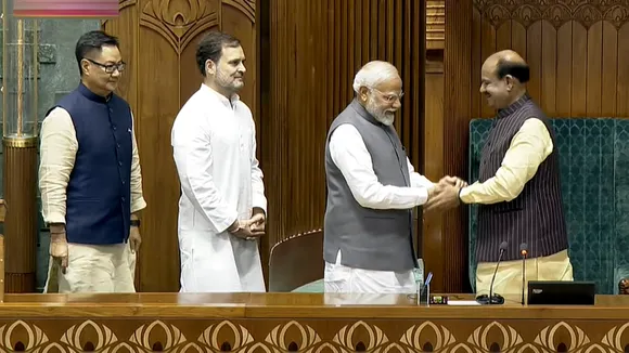 Prime Minister Narendra Modi greets Om Birla after the latter was elected as the Speaker of the House during the first session of the 18th Lok Sabha, in New Delhi, Wednesday, June 26, 2024