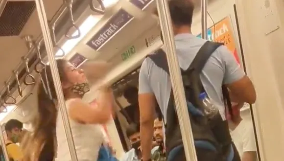 A still from the video showing woman hitting man in Delhi metro