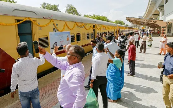Commuters take photographs of newly launched Ahmedabad-Botad passenger train. PM Modi launched the train on Saturday.