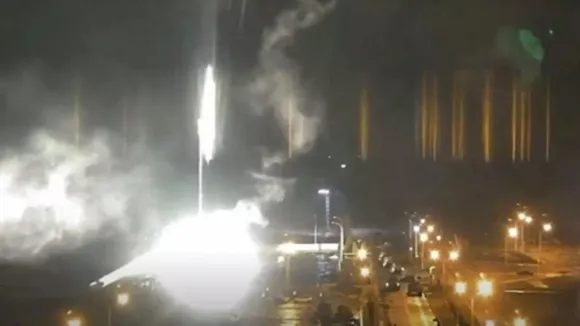 This image made from a video released by Zaporizhzhia nuclear power plant shows bright flaring object landing in grounds of the plant in Enerhodar, Ukraine