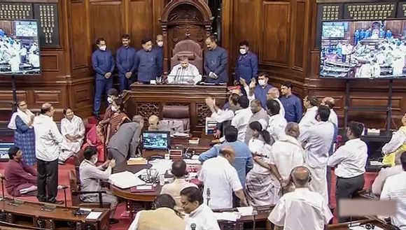Opposition members protest in the Rajya Sabha during ongoing Monsoon Session of Parliament, in New Delhi