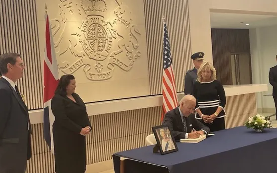 Joe Biden signs a condolence book at the British embassy in DC