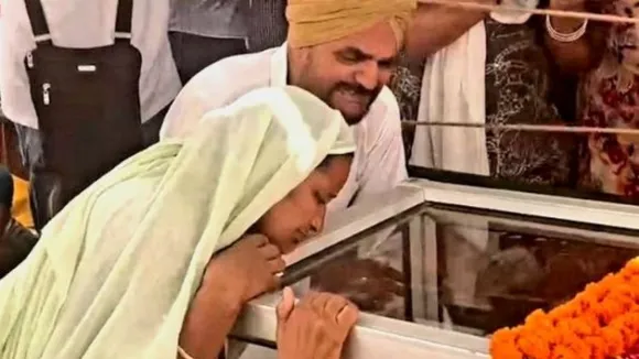 Moosewala's parents during his funeral procession