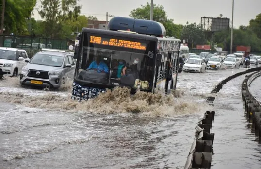 Government Bus paving its way in water logged roads in Gurugram