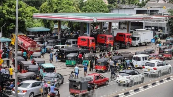 People lined up at filling station and waiting for their turn to get their vehicle refueled