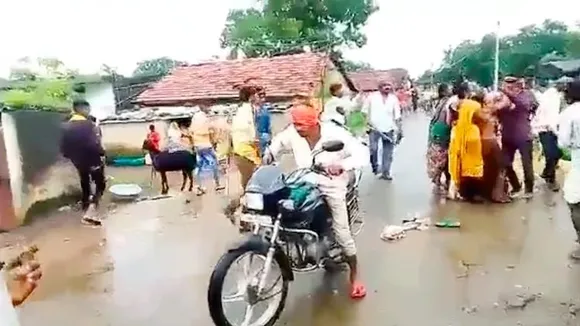 Videograb of woman being beaten up in public in Jhabua